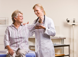 Doctor checking senior woman arm